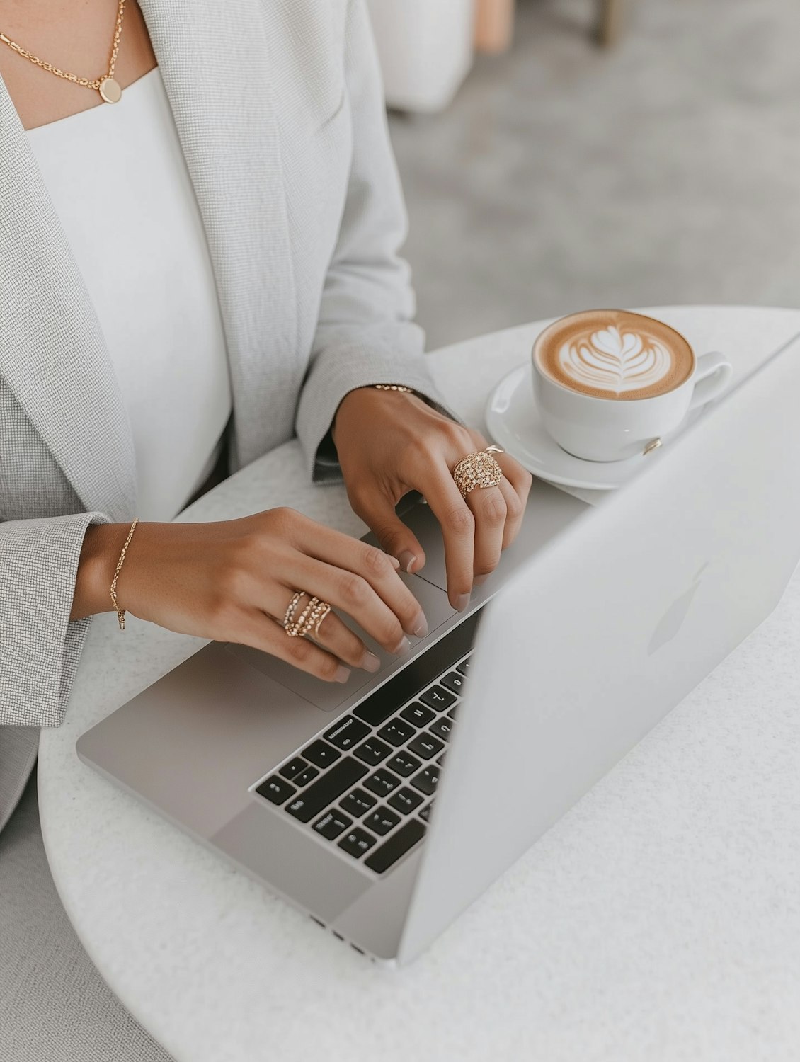 A small business owner thoughtfully reviews Instagram content on a laptop, connecting digital efforts to business growth.