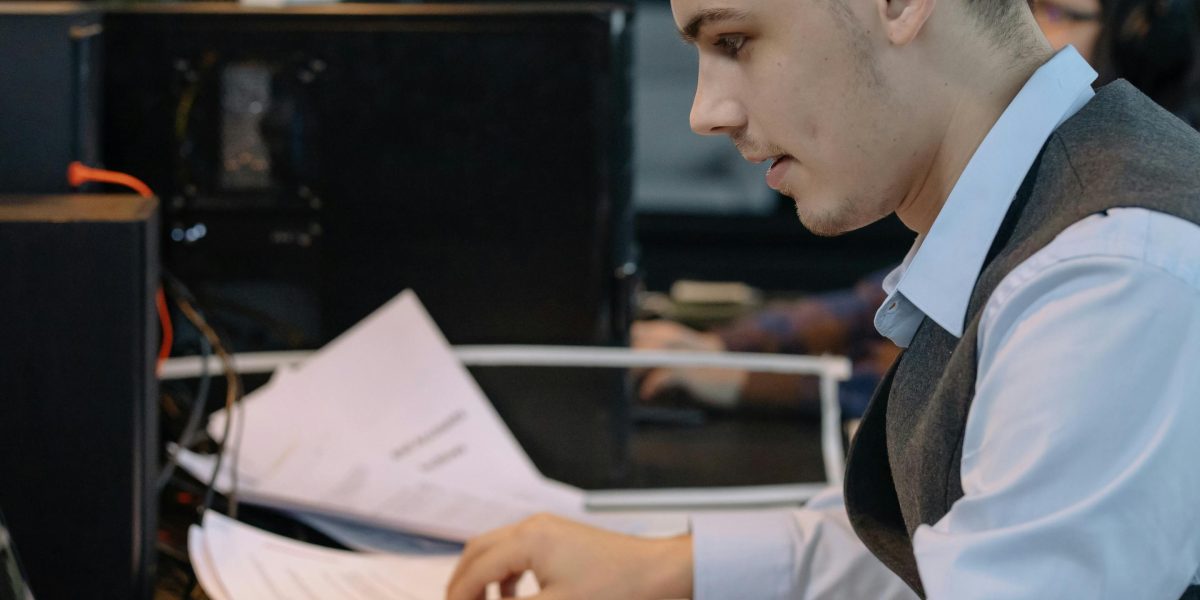 A person deeply focused on a task, symbolizing the effort in technical setup.