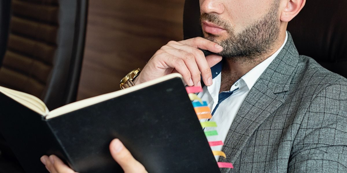 A business leader thoughtfully evaluating options, representing the decision-making process for marketing resources.