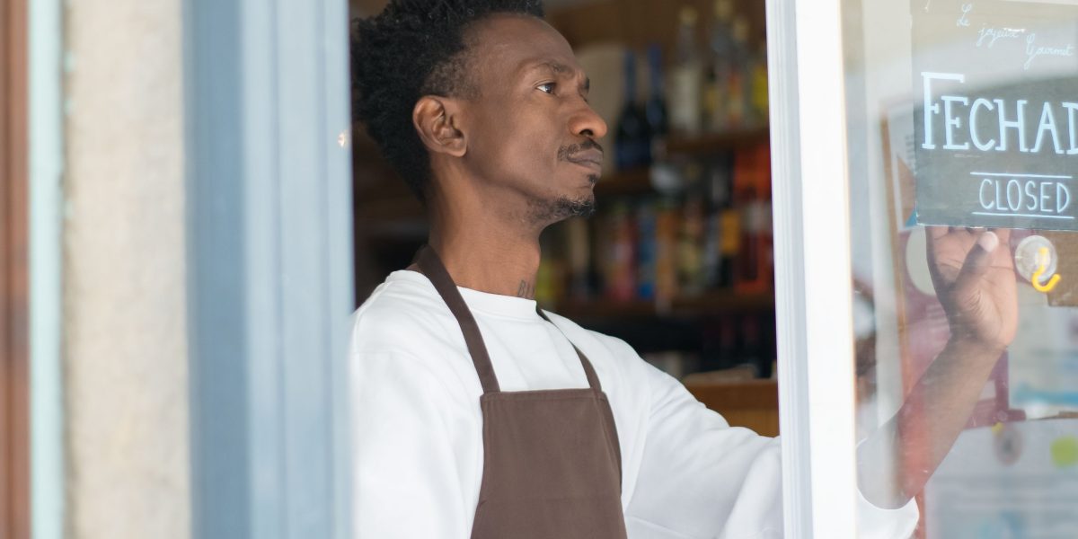 A small business owner looks confidently at future opportunities, symbolizing the potential of a diversified search strategy.