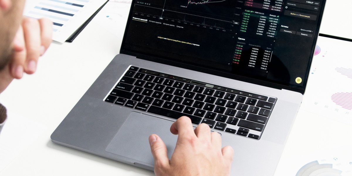 A business professional focused on analyzing performance data on a dashboard, reflecting the importance of measurement.