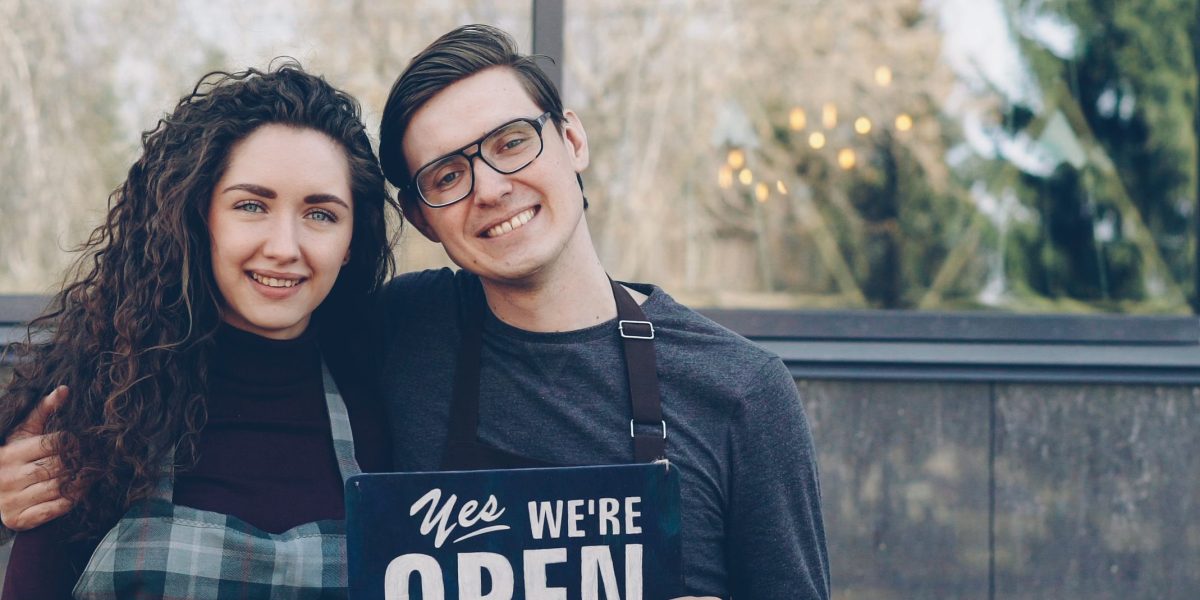 A small business owner celebrates the success and growth achieved through a well-designed online presence.