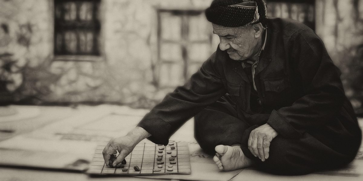 A small business owner looking thoughtful, contemplating digital strategy challenges.