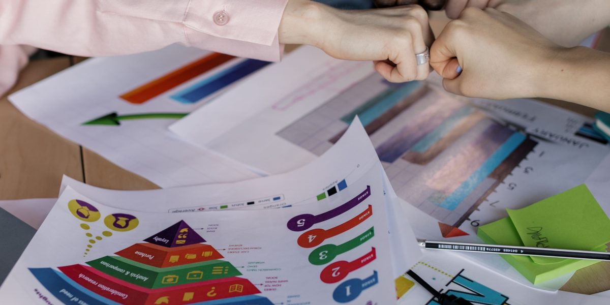 A diverse business team collaborating in a meeting, focused on defining clear objectives.