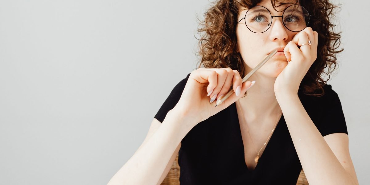 A small business owner reflecting on website performance and lead generation strategies.