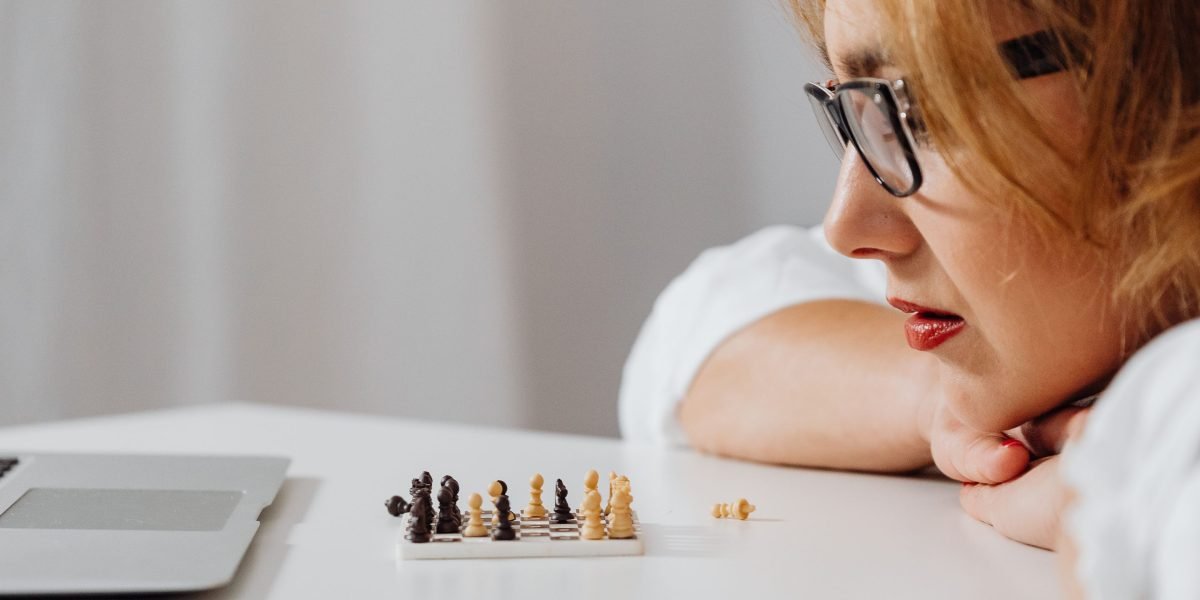 A small business owner contemplating challenges related to online presence and digital strategy.