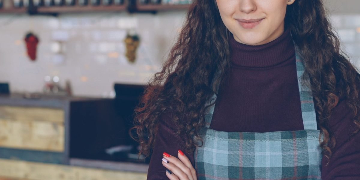 A confident small business owner envisions growth and expanded customer reach.