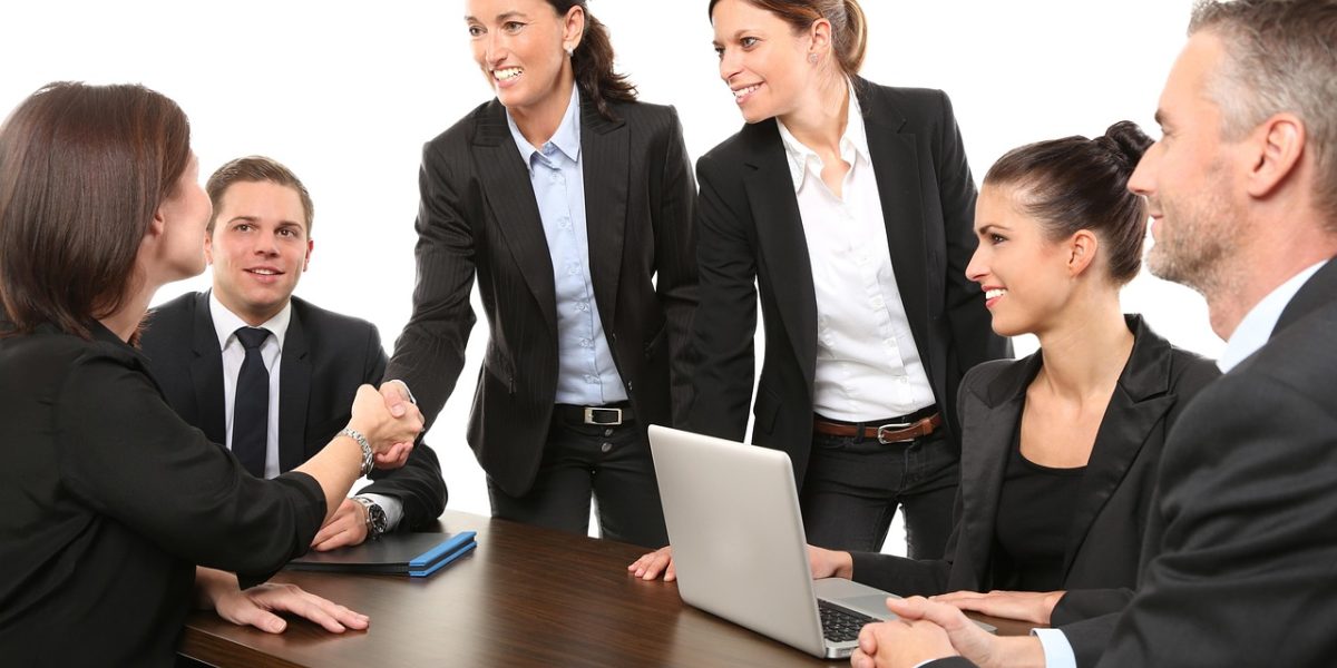 A business team carefully reviews proposals from potential SEO agencies, highlighting the importance of thorough evaluation.