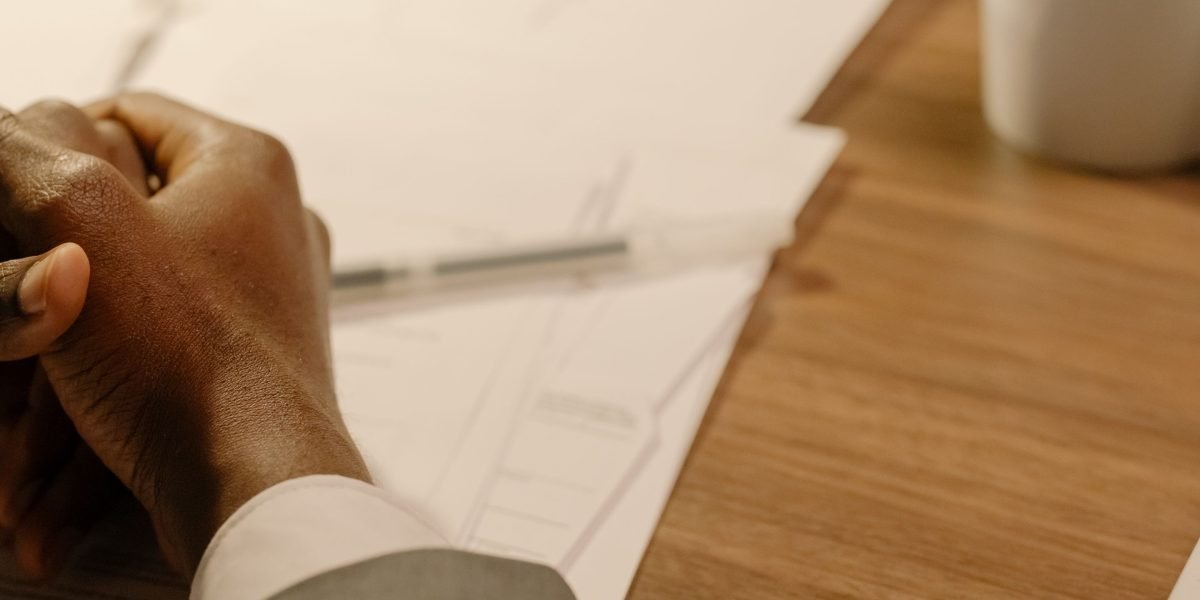A person deeply considers various options to make a strategic business decision.
