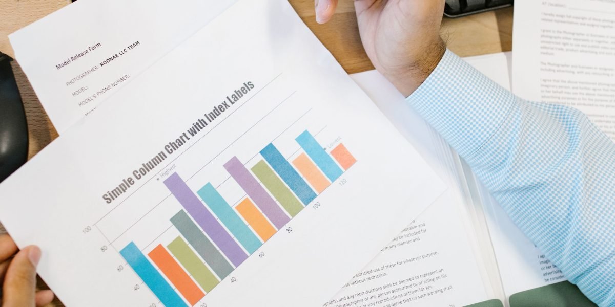 A person reviewing reports, satisfied with the positive impact of their work.